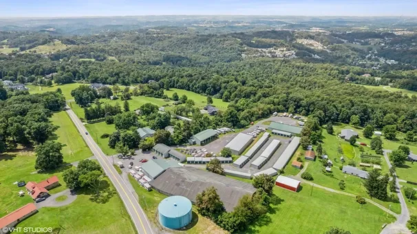 Aerial view of storage facility near water tower.