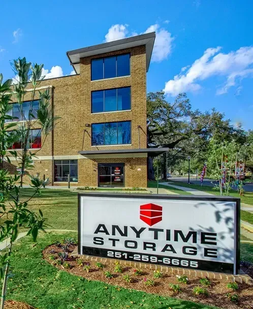 Anytime storage sign outside a tall storage facility