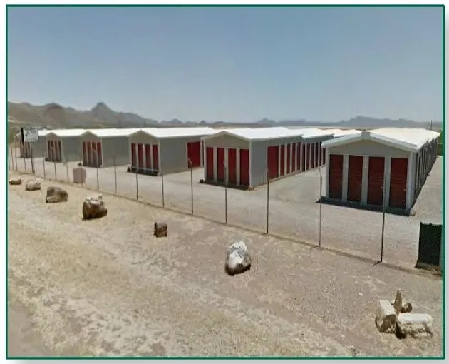 view over looking a fenced in storage facility.