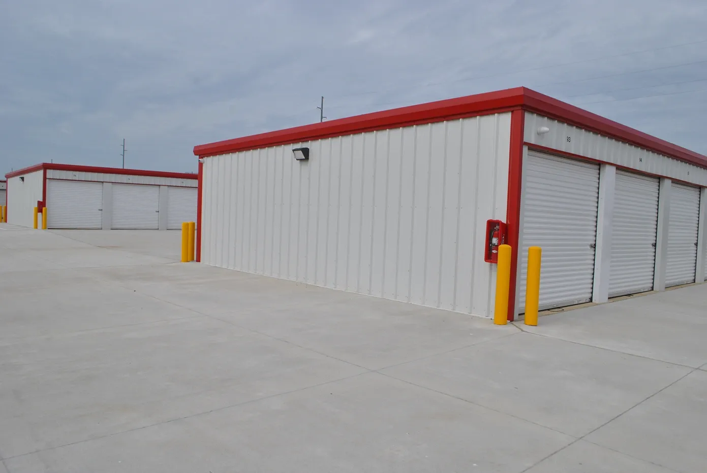 Side of outdoor storage units with lights.