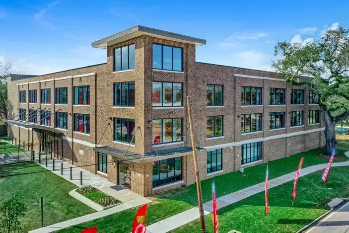 Aerial view of sale flags outside a storage unit