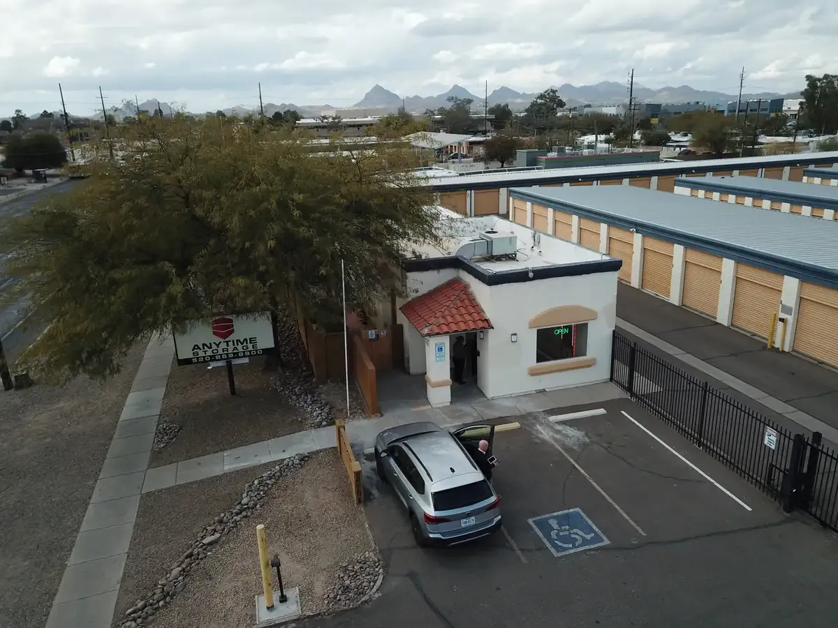 Office at storage facility with car in the front of building 