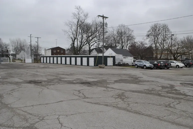 Large paved ground with storage units.