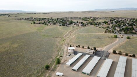 ariel view of a storage facility with drive up units and uncovered vehicle parking