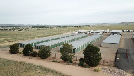 view overlooking storage facility with drive up units and covered vehicle parking